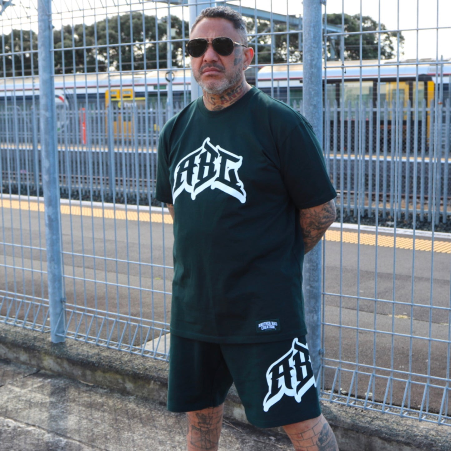 MENS ANOTHER BAD CREATION - PRISON GREEN STADIUM SHORTS 20” - 5961S - LAST STOCK
